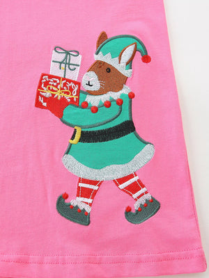 Pink cotton baby dress with embroidered elf holding gifts.