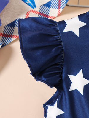 Navy blue baby dress with white stars and ruffled sleeves.