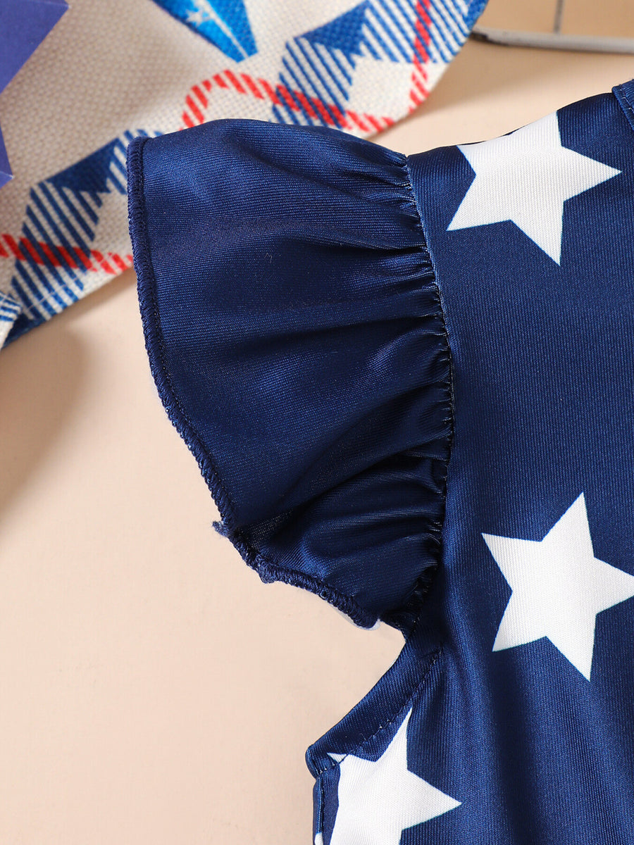 Navy blue baby dress with white stars and ruffled sleeves.