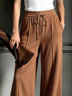 wide-leg pants featuring ribbed in Apricot Color with 100% polyester Care instructions: Machine wash cold texture