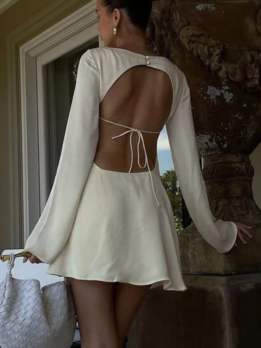 Cream long sleeve mini dress with open back and tie detail