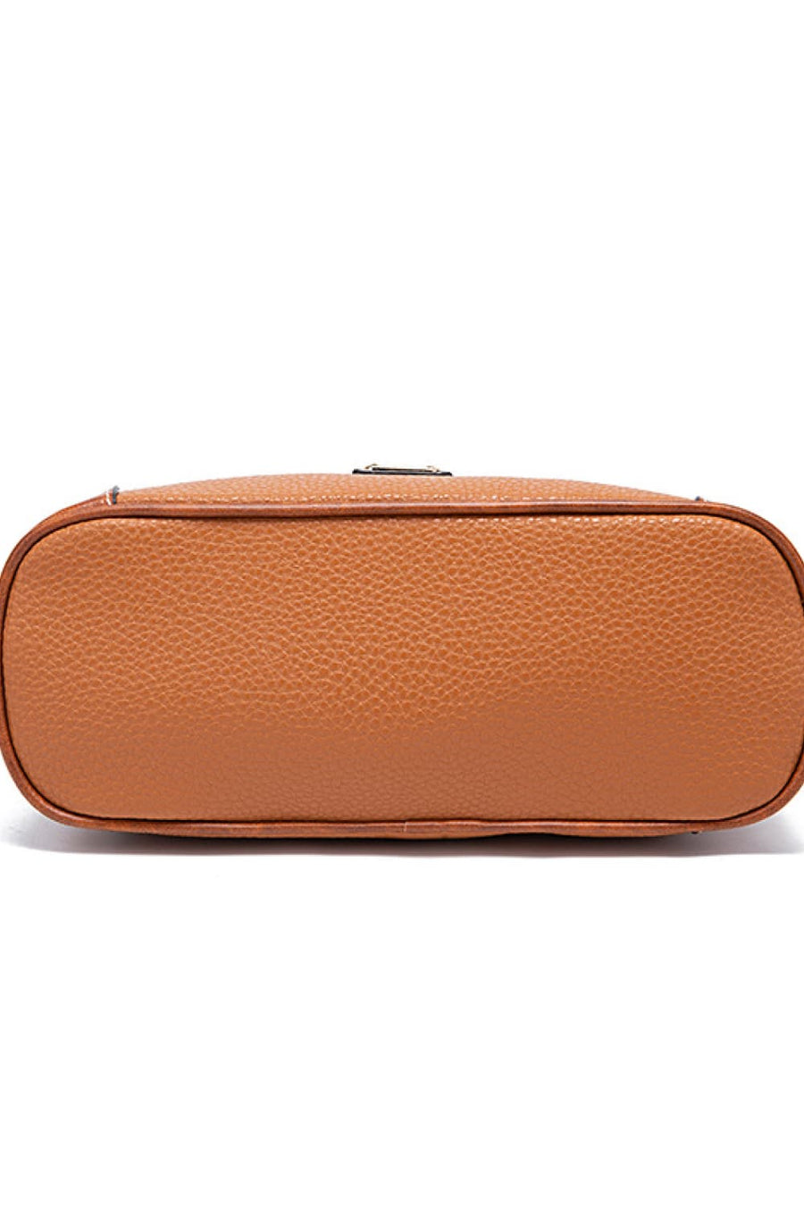 Golden Hour Leather Crossbody bag in Ochre with textured leather and brown trim.