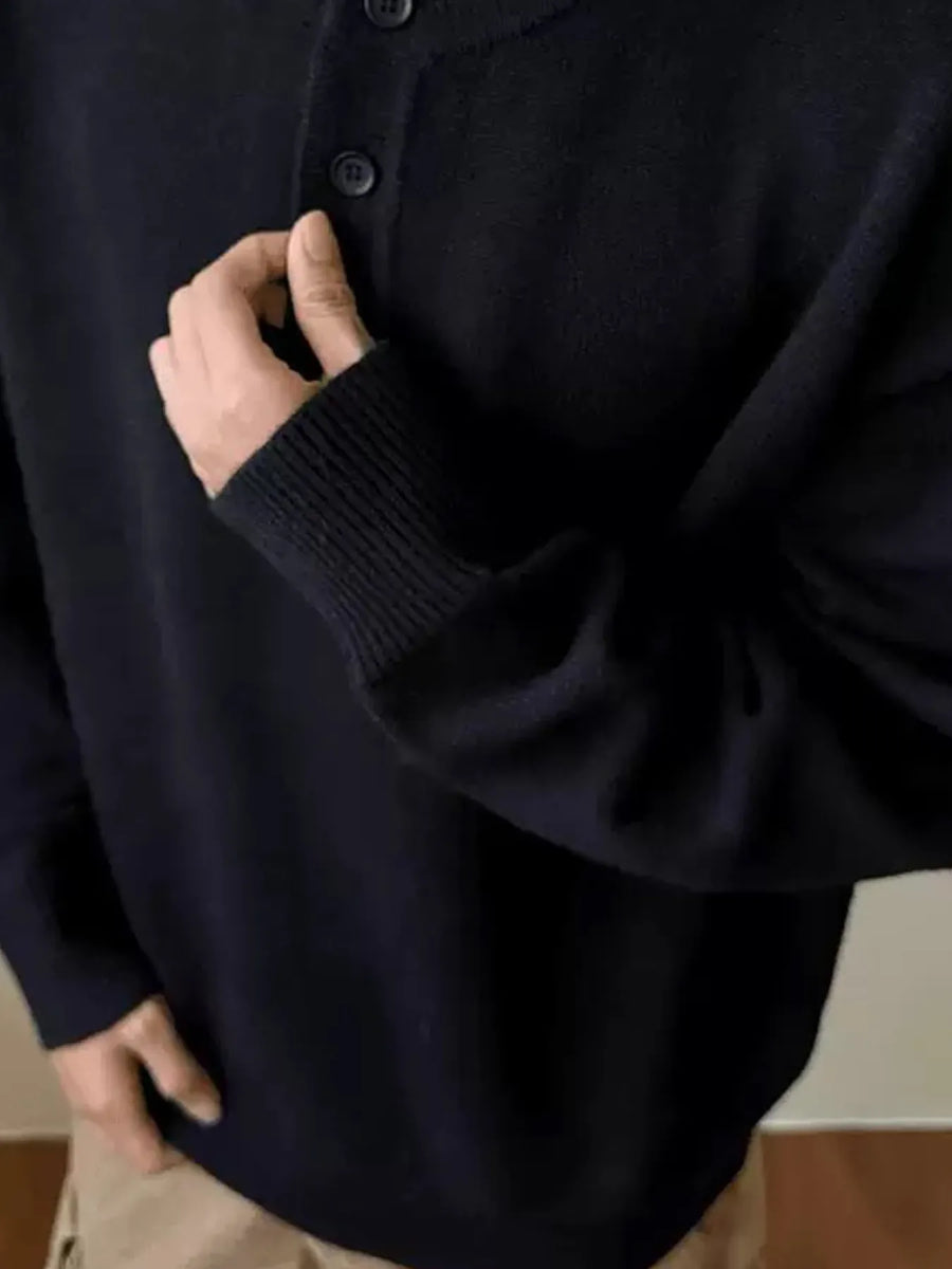 Black button detail drop shoulder sweater with ribbed cuffs and collar.