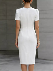 White midi dress with short puff sleeves, ruched waist detail, and a back zipper.