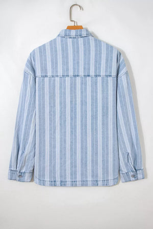 Relaxed fit denim shacket with vertical stripes, button-down front, and chest pockets.