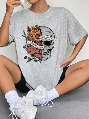 Grey oversized tee with a skull and floral graphic that says "Kinda Emotional" and "Kinda Emotionless".