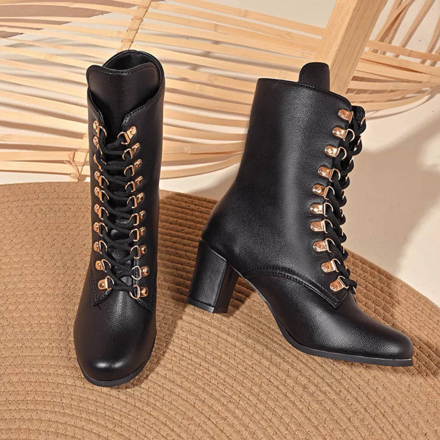Black lace-up block heel boots with gold eyelets and laces.