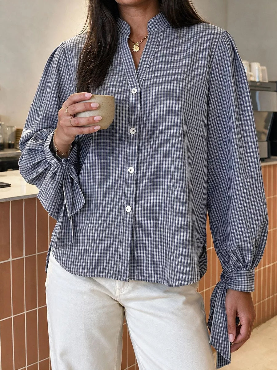 white button-up shirt featuring tied sleeves and gingham
