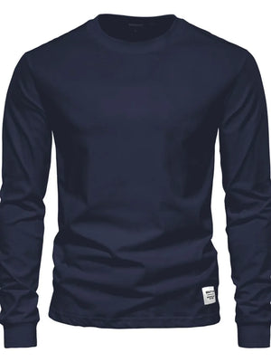 Navy crewneck long sleeve t-shirt with a small white tag detail on the hem.