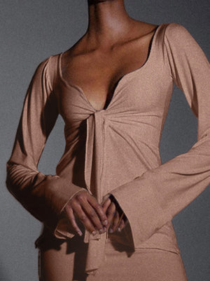 Khaki tie-front long sleeve blouse with deep V-neck and flattering drape.