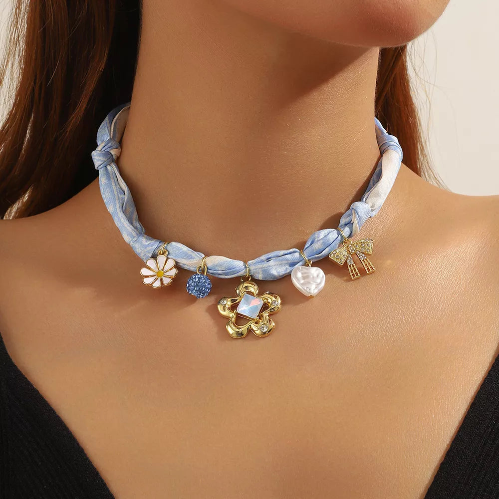 necklace in light blue featuring charms and straight fit