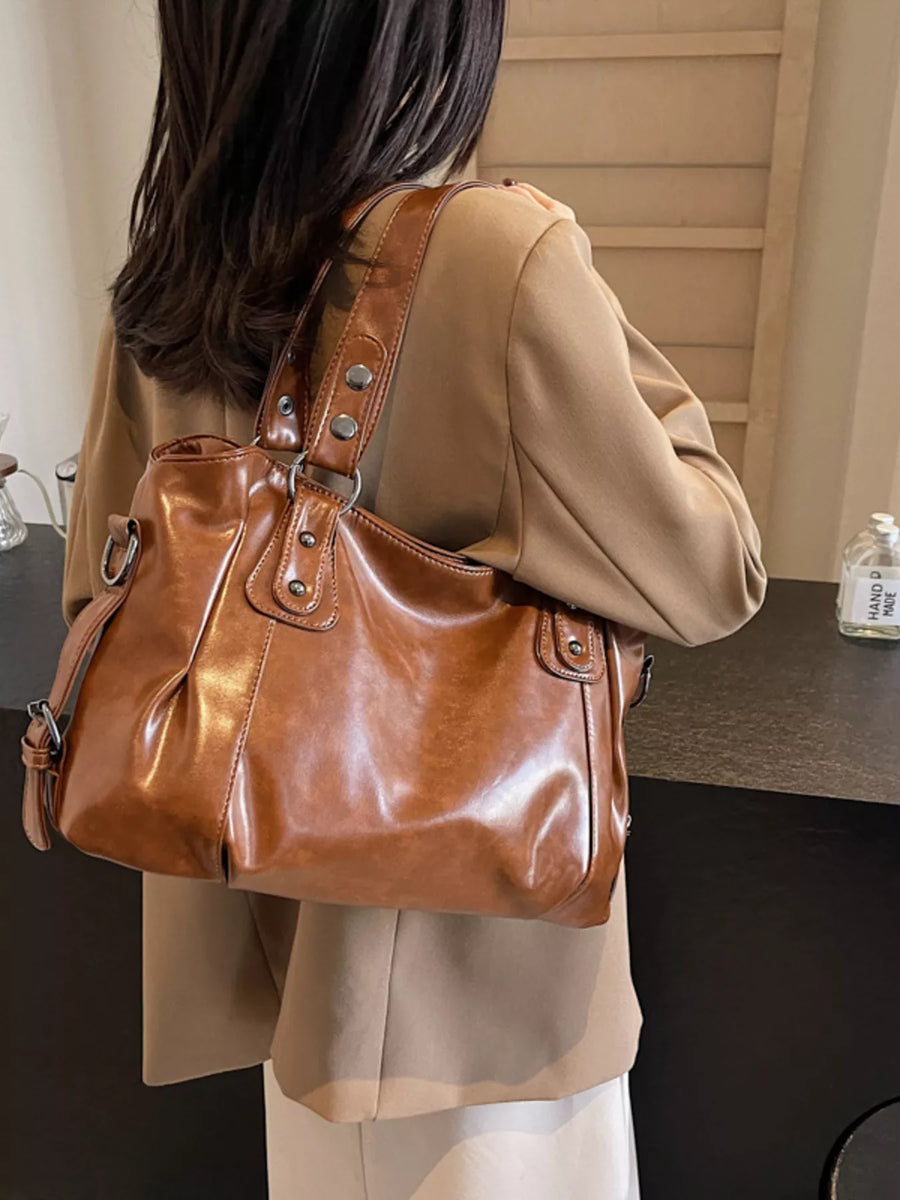 Large brown vintage PU leather shoulder bag with silver hardware and adjustable strap.