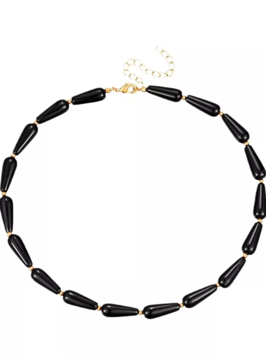Elegant black teardrop choker necklace with gold accents and clasp
