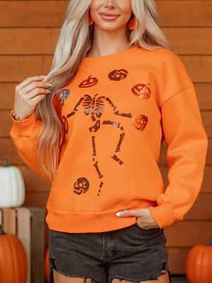 crewneck sweater in Orange with graphic and sequin embellishment