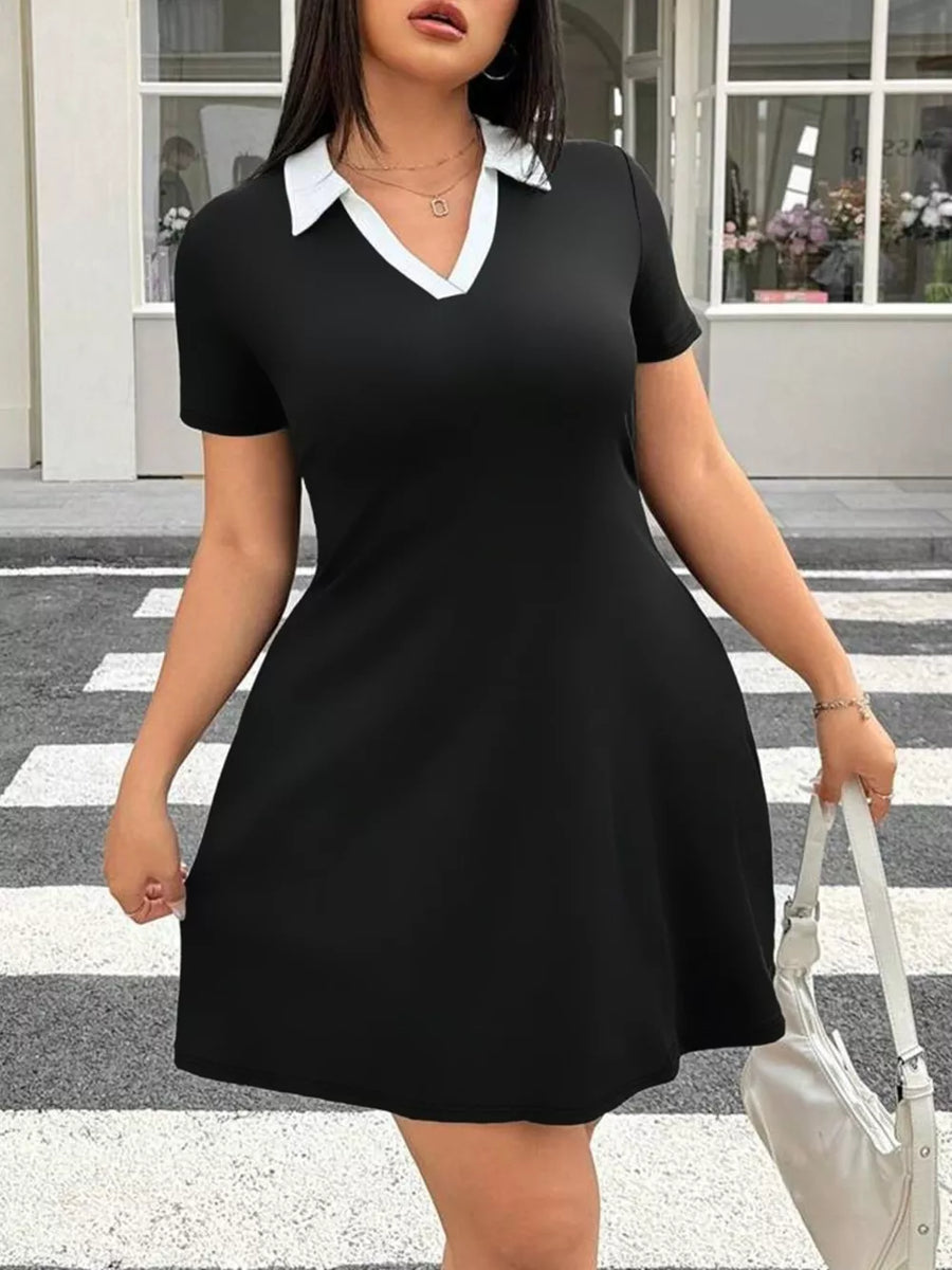 Black plus-size mini dress with short sleeves and a white contrast collar.