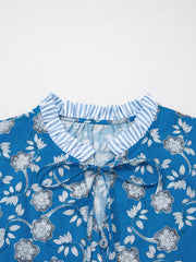 Blue floral cotton blouse with tie neck and ruffled collar