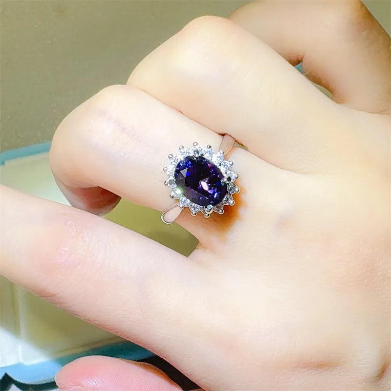 Amethyst sunburst moissanite ring in silver with halo detail.