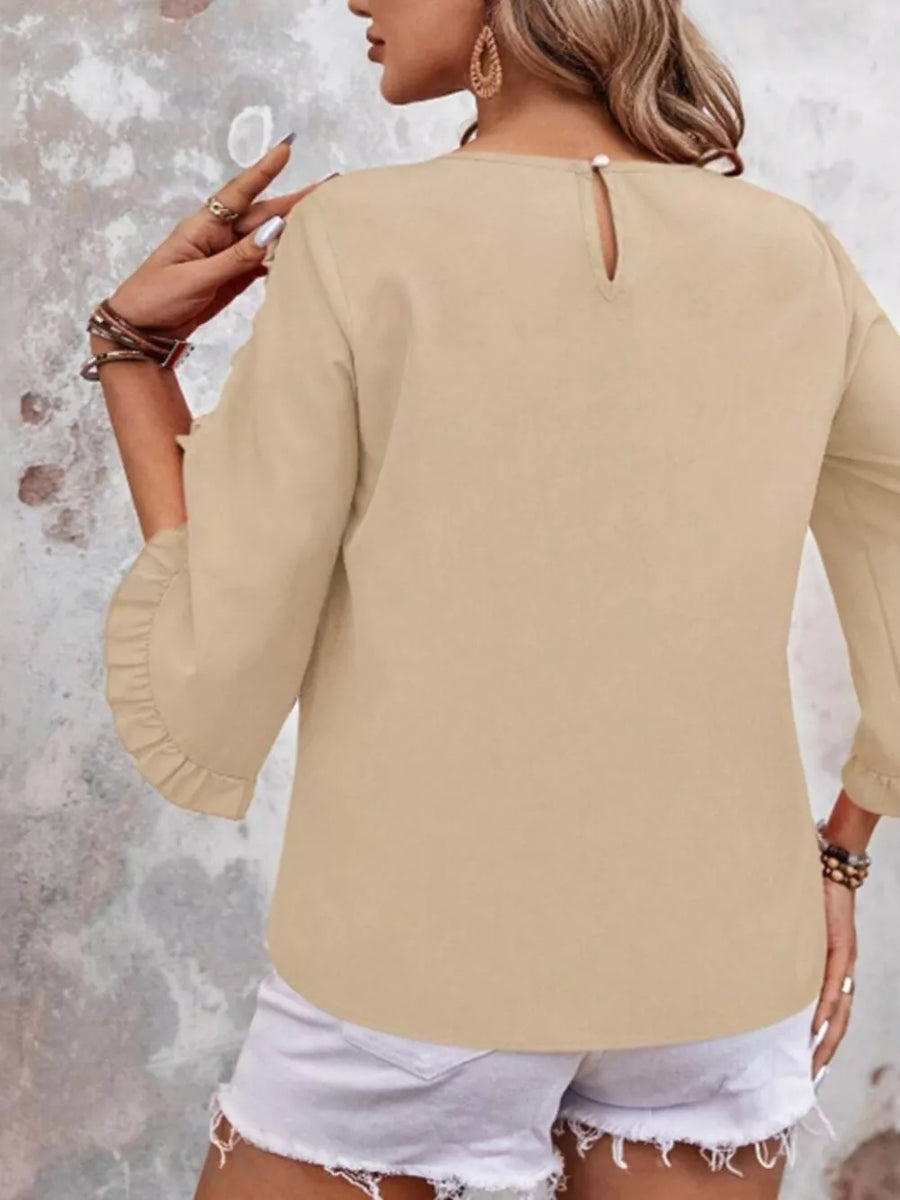 Apricot ruffled sleeve blouse with button detail and keyhole back.
