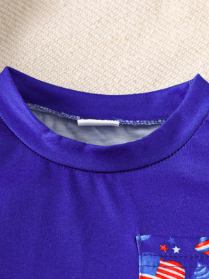 Baby tee with American flag pocket detail, round neck, short sleeves.