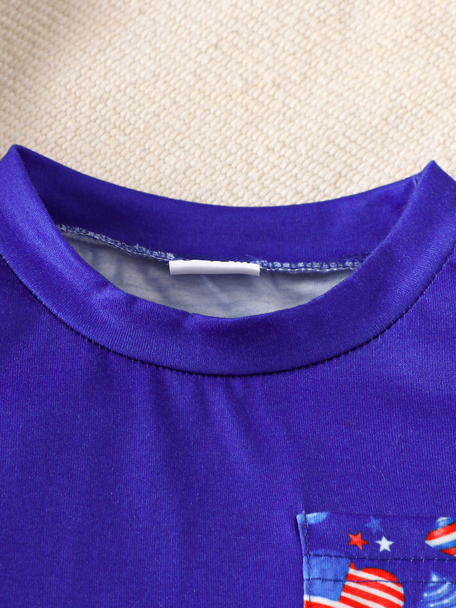 Baby tee with American flag pocket detail, round neck, short sleeves.