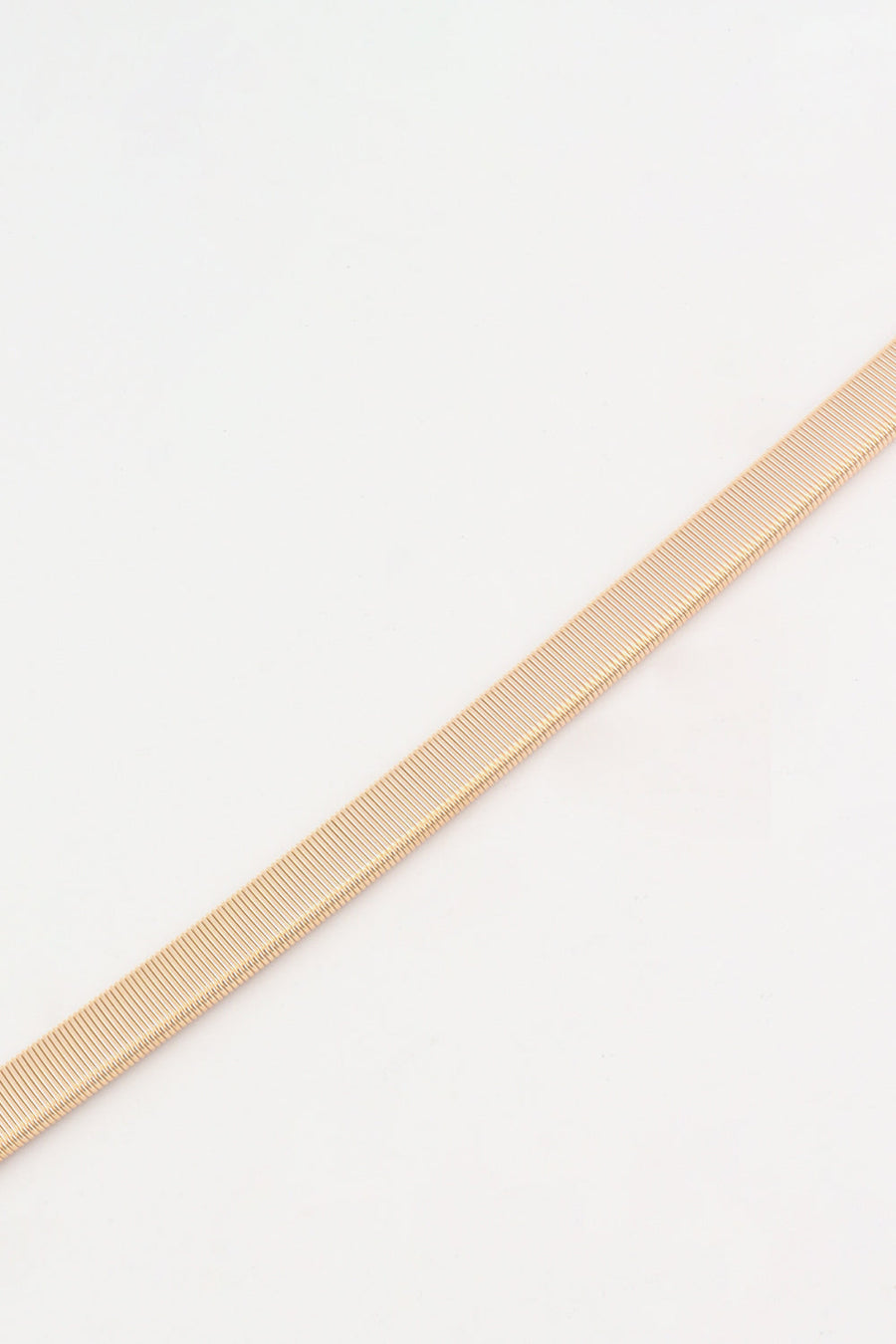 Slimline rose gold elastic waist belt with ribbed texture detail