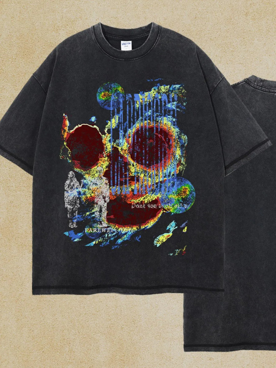 Black acid wash graphic t-shirt with abstract skull art and text details.