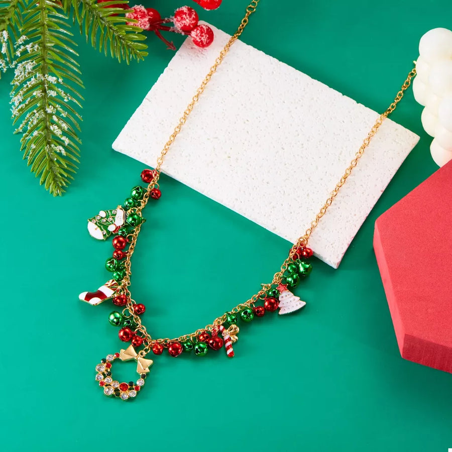 necklace in gold with novelty and charm details