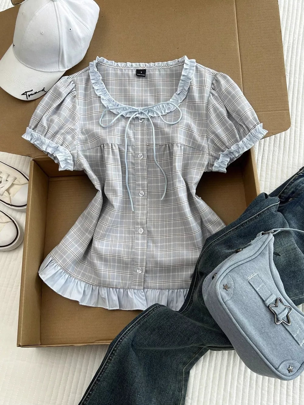 light gray blouse with hip-length and button-front