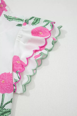 White cotton blouse with pink floral print and scalloped trim sleeves
