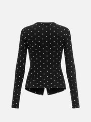 Black cardigan featuring buttoned and polka dot