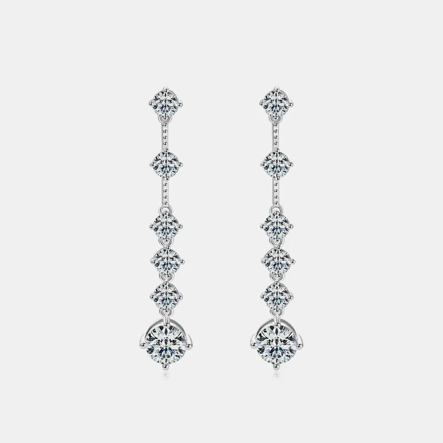 Silver cascading diamond drop earrings with multiple brilliant-cut stones.