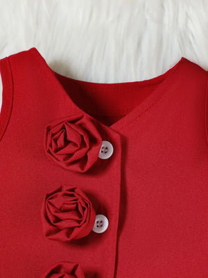 Wine red baby vest with decorative floral appliques and buttons.