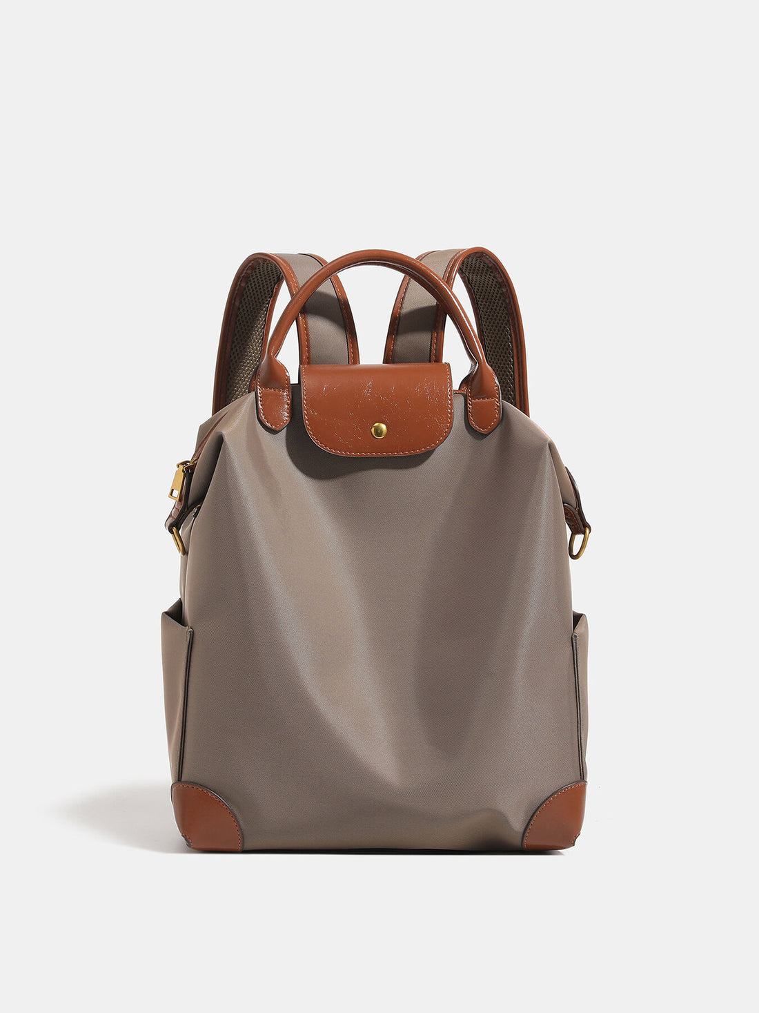 backpack in taupe featuring top handle and structured fit