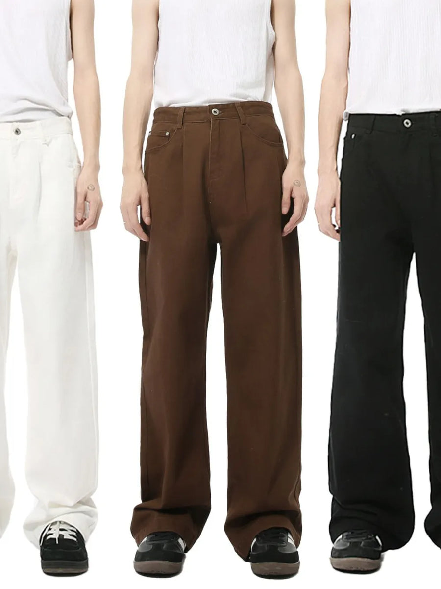 Pleated denim wide-leg trousers in black, chocolate, and ivory.