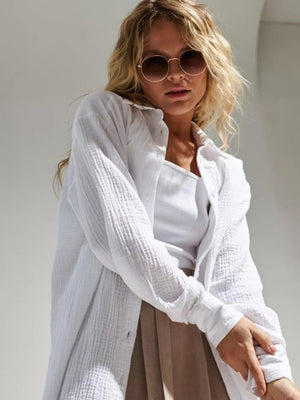 button-down shirt in white featuring button cuffs and relaxed fit