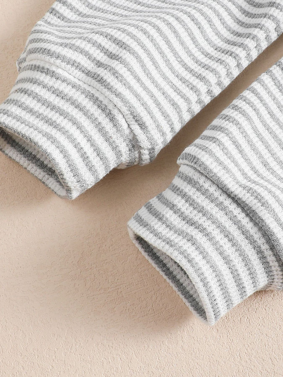 Children's grey and white striped cotton sweatshirt and pants set cuffs.