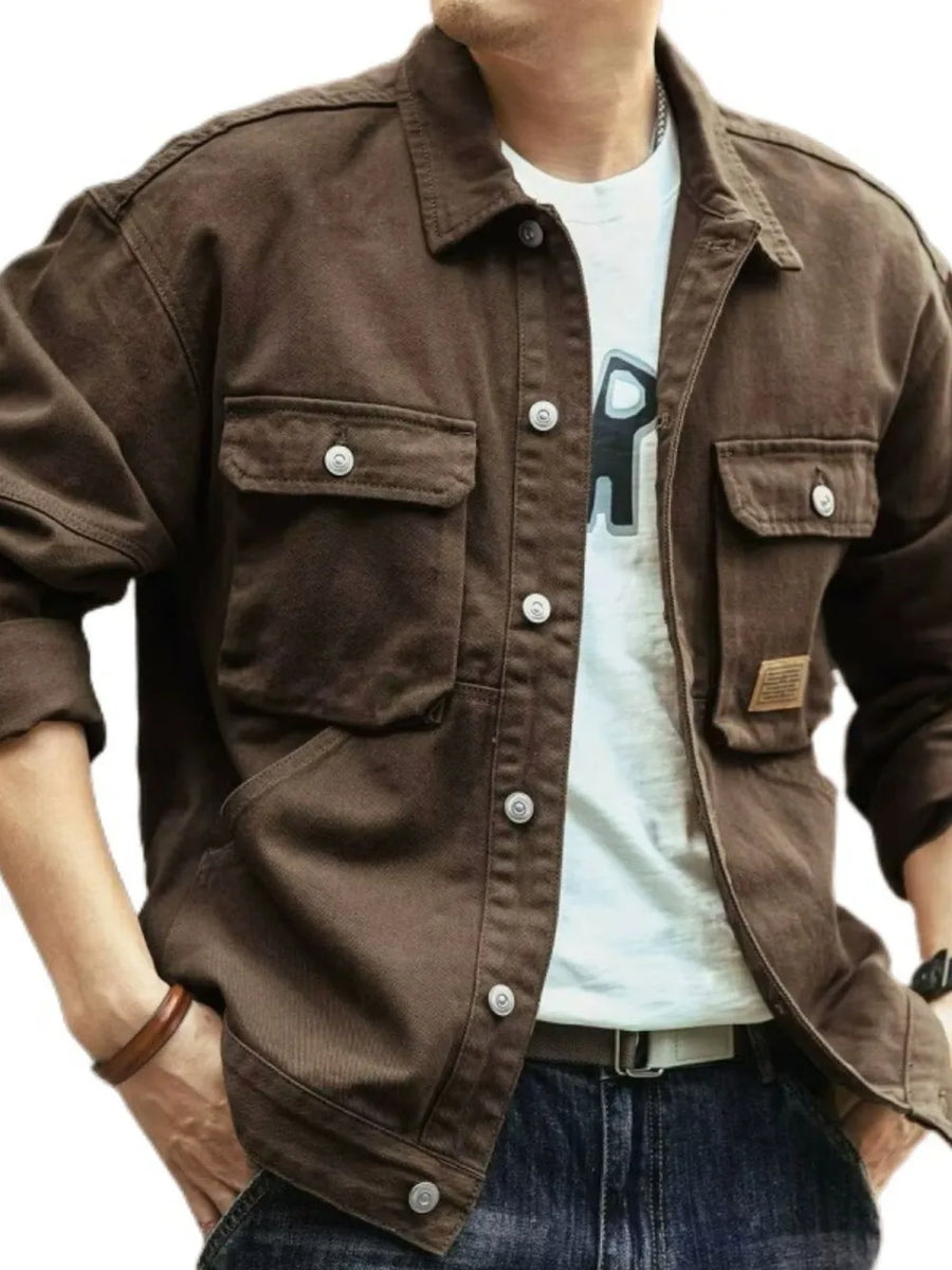 Coffee brown washed cotton chore jacket with four front utility pockets and button closure.
