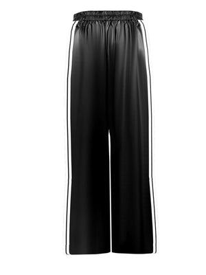 Black faux leather wide leg track pants with white side stripes and elastic waistband.