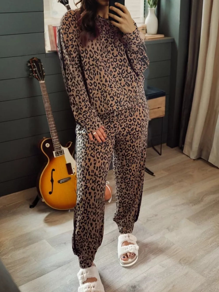 Leopard print joggers with drawstring waist and cuffed ankles.
