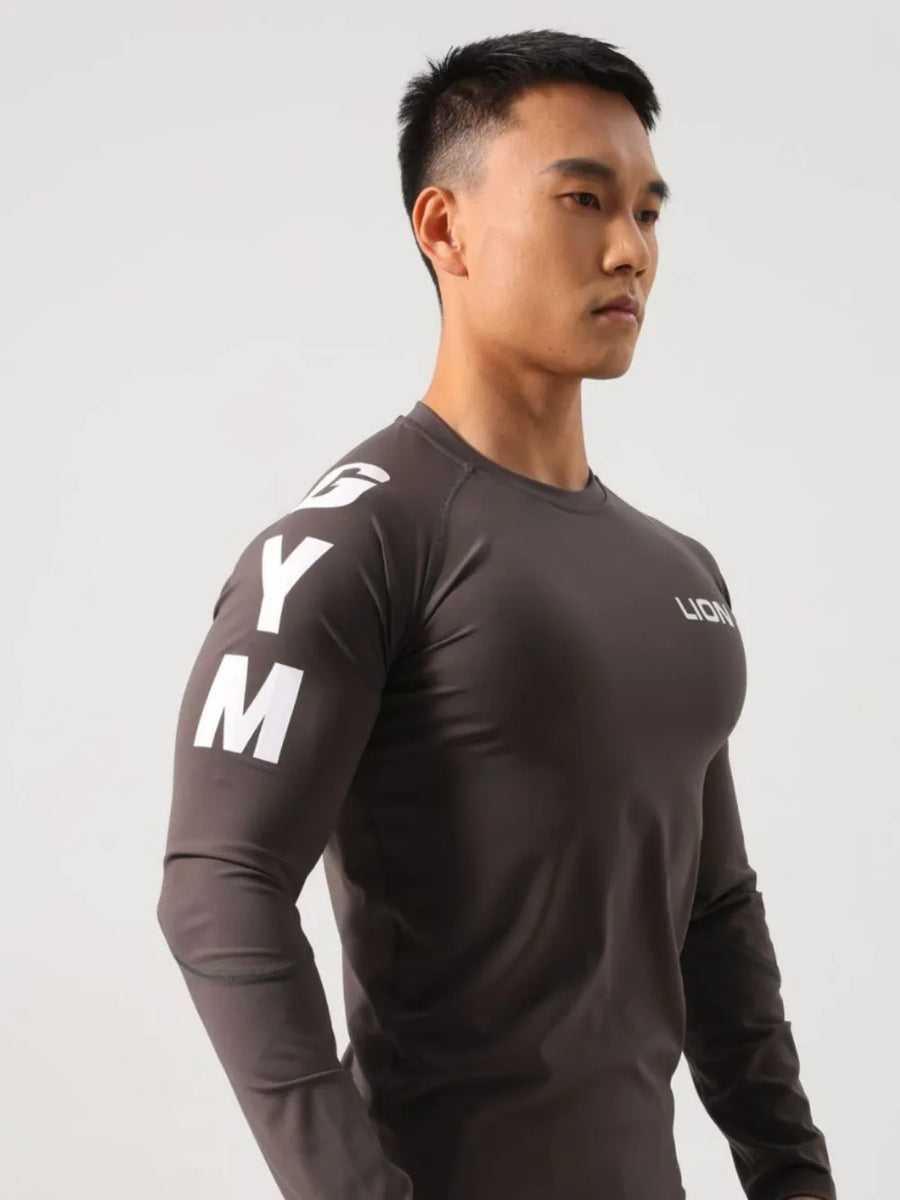 Dark gray performance raglan sleeve tee with white logo on sleeve and chest.