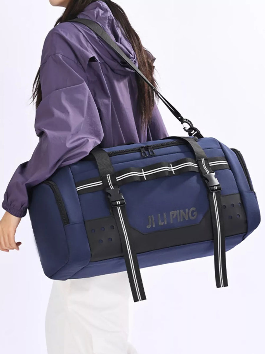 Blue Oxford cloth travel tote bag with black accents and white stripe details.
