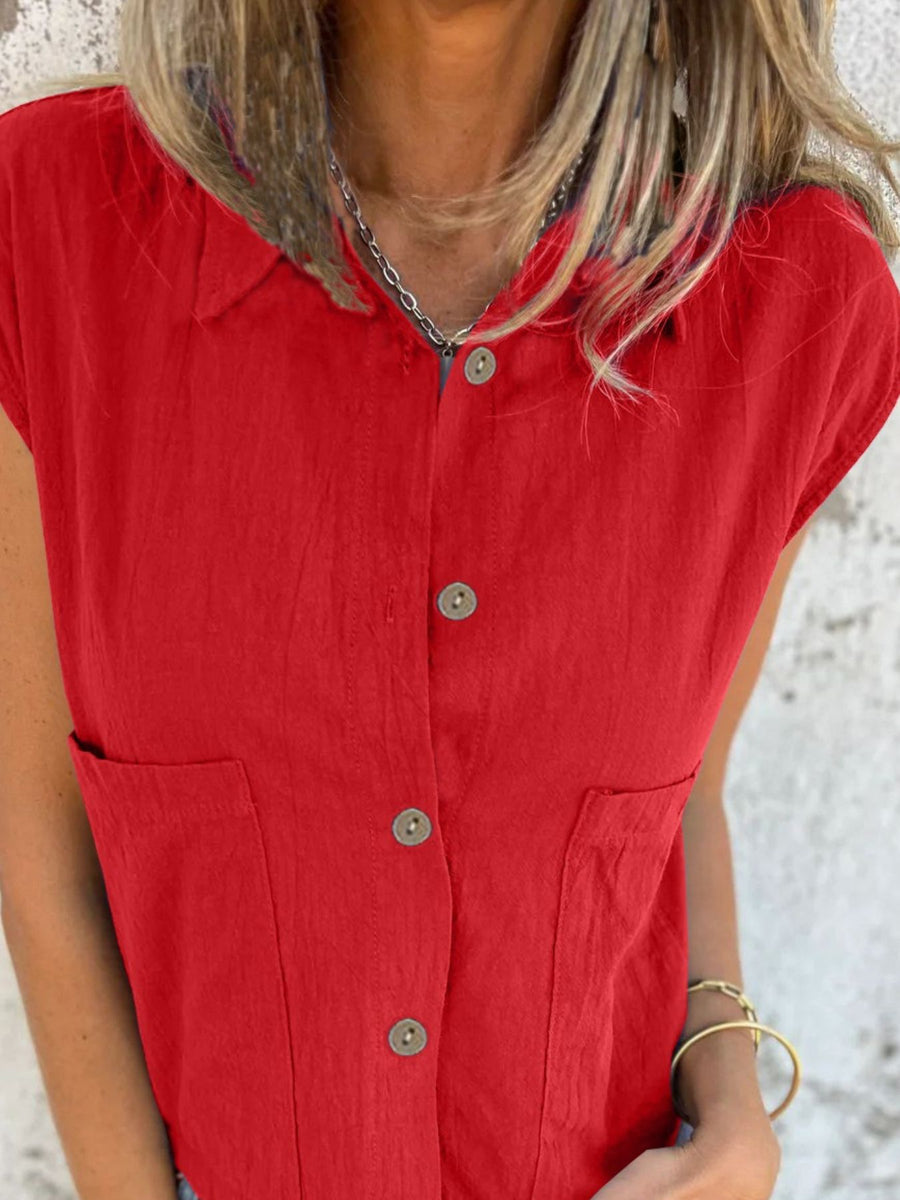 Scarlet button-down cap sleeve shirt with two chest pockets and a collared neckline.