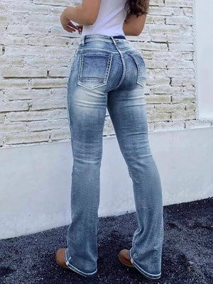 Blue cotton high-waisted bootcut jeans with button closure and distressed detailing.