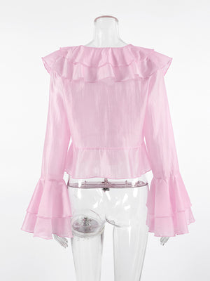 Pink ruffle trim long sleeve blouse with dramatic bell sleeves and peplum hem.