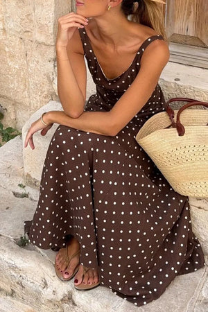 Brown polka dot midi dress with scoop neck and thin straps.
