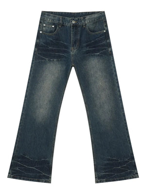 Faded wash flare jeans in dark denim with a bootcut leg and distressed details.