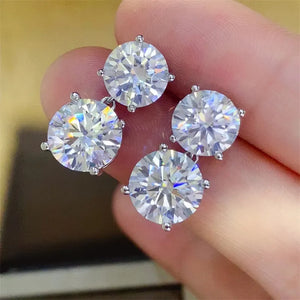 Silver double-drop cubic zirconia stud earrings with sparkling round-cut stones.