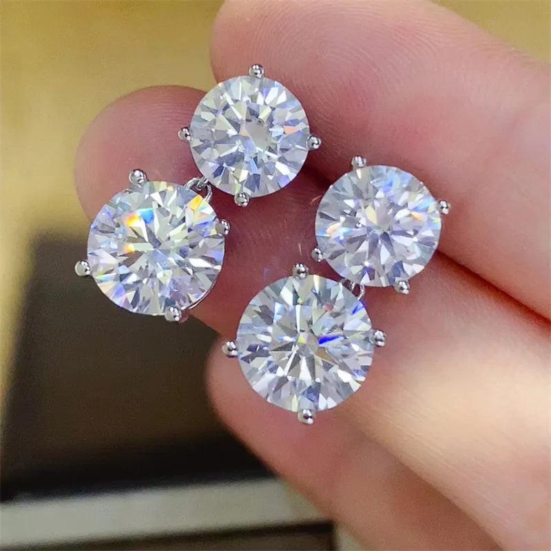 Silver double-drop cubic zirconia stud earrings with sparkling round-cut stones.