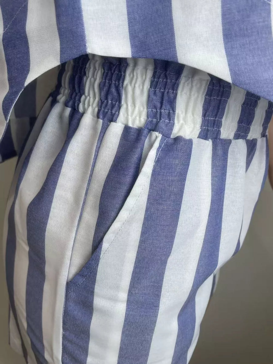 Chic striped two-piece set in royal blue and white with elastic waist shorts and pocket detail.