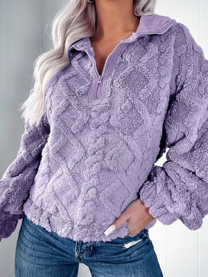 Purple textured fleece quarter zip sweatshirt with diamond pattern and ribbed collar.